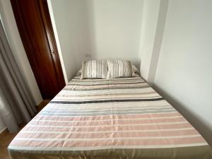 Postel nebo postele na pokoji v ubytování Apartamento Hostal Mellizo