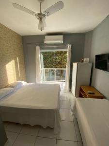 Un ou plusieurs lits dans un hébergement de l'établissement Caminho do Mar Hotel