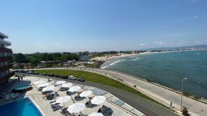 a view of a beach with umbrellas and the ocean at PARADISO 'В' 408 Private Studio Nessebar in Nesebar +79 photos
