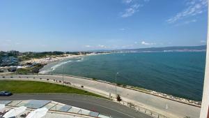 a view of a beach and the ocean at PARADISO 'В' 408 Private Studio Nessebar in Nesebar