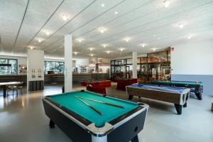 a pool table in a room with billards at Alp Hotel Masella in La Masella