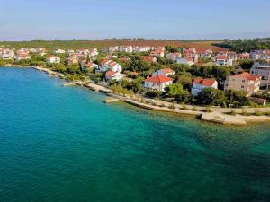 an aerial view of a small island in the water at Petrcane house in Petrcane