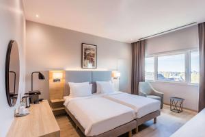 Voodi või voodid majutusasutuse Radisson Blu Conference Hotel, Düsseldorf toas