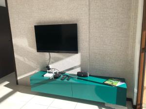 En tv och/eller ett underhållningssystem på Barra Bali Resort - Barra de São Miguel - Alagoas