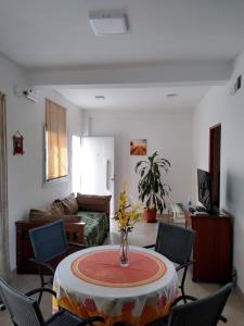 a living room with a table and chairs at Brisas del Parque in Salta