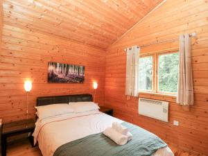 Кровать или кровати в номере Pochard Lodge