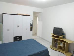 Apartamento no Mar Grosso em Laguna SC. tesisinde bir odada yatak veya yataklar