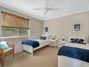 Katil atau katil-katil dalam bilik di The Sanctuary at Greenfield Beach by Experience Jervis Bay