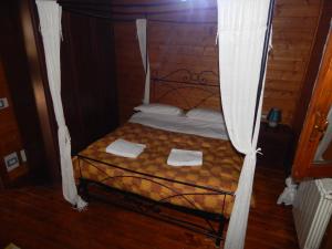 a bedroom with a bed with a canopy at House 8 With 2 Bedrooms In The Countryside Of Rome in Marina di Cerveteri