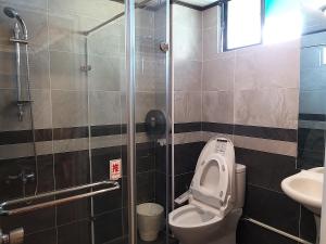 Koupelna v ubytování Guan Lun Hotel