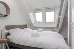 Een bed of bedden in een kamer bij Appartement Waterrijck Sneekermeer, Sneek - Offingawier