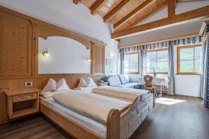 Katil atau katil-katil dalam bilik di Pensione Camoscio