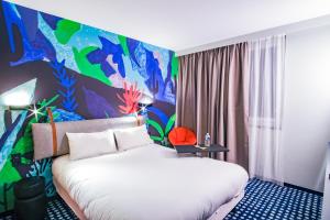 Postel nebo postele na pokoji v ubytování ibis Styles Albertville