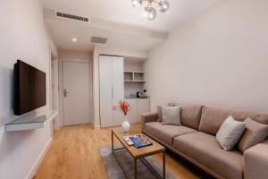 A television and/or entertainment centre at The Pearl Suites