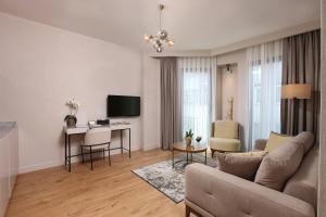 A television and/or entertainment centre at The Pearl Suites