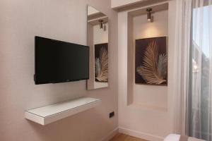 A television and/or entertainment centre at The Pearl Suites
