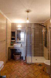 a bathroom with a sink and a shower at Casa da Torre in Minas de São Domingos