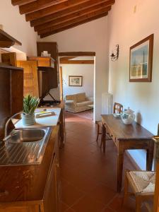 a kitchen with a sink and a table at Tenuta Lupinari in Bucine