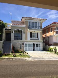 a large house with a large driveway in front of it at Omah Kumpul Sentul in Bogor
