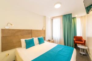 Postel nebo postele na pokoji v ubytování Taksim Hotel V Plus