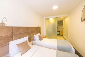 Postel nebo postele na pokoji v ubytování Taksim Hotel V Plus