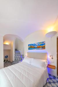 Postel nebo postele na pokoji v ubytování Ischia Mavilan Luxury Apartments + 37 fotografií