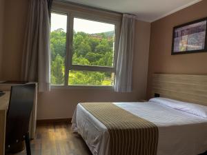 Voodi või voodid majutusasutuse Somriu Hotel Vall Ski toas