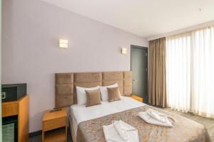 Postel nebo postele na pokoji v ubytování Taksim Hotel V Plus