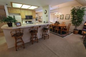 a kitchen and dining room with a table and chairs at Silver Bear 18 Condo in Mammoth Lakes