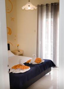 Postel nebo postele na pokoji v ubytování Hotel Tassos-Despina