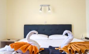 Postel nebo postele na pokoji v ubytování Hotel Tassos-Despina