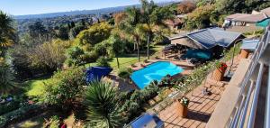 an aerial view of a house with a swimming pool at Over The Moon Guesthouse in Johannesburg