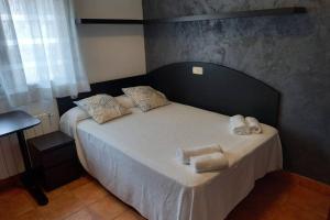 Un pat sau paturi într-o cameră la Casa céntrica en Platja d'Aro, a 5min de la playa