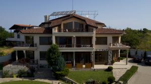 a large house with a solarium on top of it at Family Hotel Dreams in Sozopol