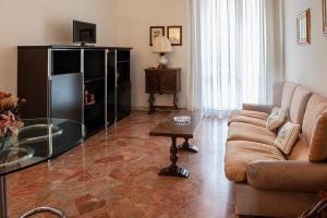 a living room with a couch and a table at Appartamento "Casa Mia" Florence in Florence