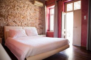 Postel nebo postele na pokoji v ubytování Skinos House