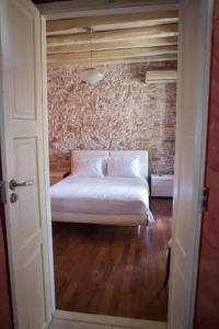 Postel nebo postele na pokoji v ubytování Skinos House