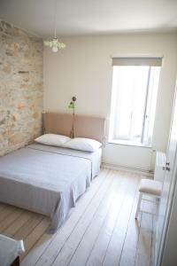 Postel nebo postele na pokoji v ubytování Skinos House