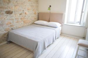 Postel nebo postele na pokoji v ubytování Skinos House
