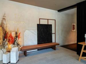 a living room with a couch and a table at L'Esquisse Hotel & Spa Colmar - Mgallery in Colmar