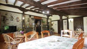 a dining room with a table and chairs at Casa Las Vegas in Potes