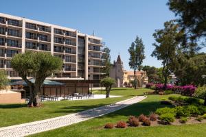 a view of a building and a park at Vila Gale Cascais in Cascais