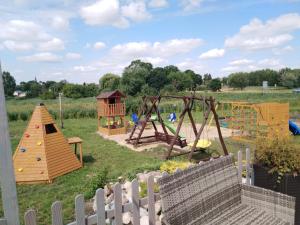 a park with a playground with a play equipment at Rybakówka in Rejowiec