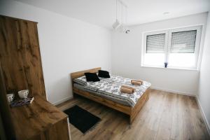 Posteľ alebo postele v izbe v ubytovaní Apartamenty Perła Orawy