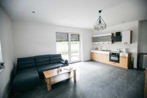 Kuchyňa alebo kuchynka v ubytovaní Apartamenty Perła Orawy