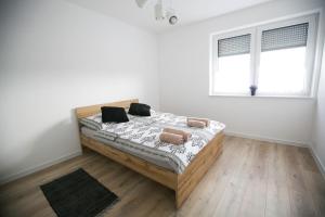 Posteľ alebo postele v izbe v ubytovaní Apartamenty Perła Orawy