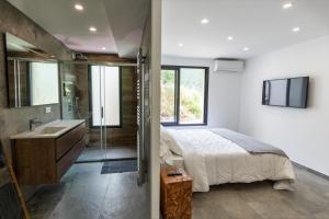 Postel nebo postele na pokoji v ubytování U CAVALLU - Luxe entre Mer et Montagne