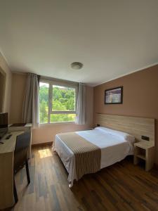 Voodi või voodid majutusasutuse Somriu Hotel Vall Ski toas