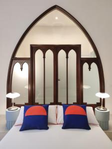 En eller flere senge i et værelse på Casa Celeste Aida