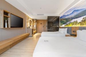 TRUE Go hotel客房内的一张或多张床位